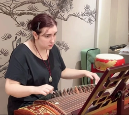 Students learning to play the guzheng, a traditional Chinese instrument, during a study tour with RPL Language School, China